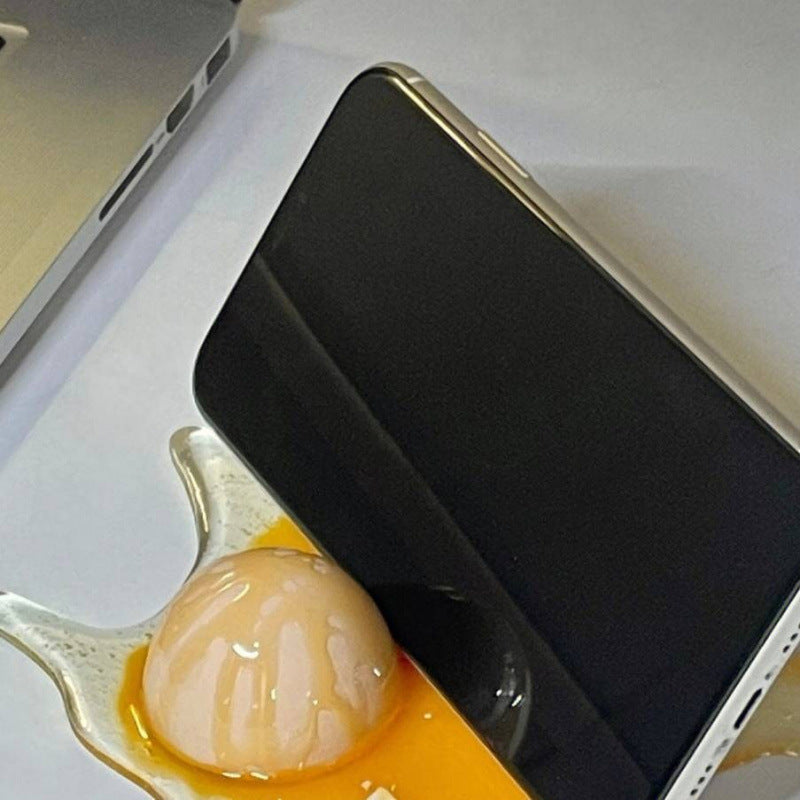 Funny "Spilled Broken Egg" Realistic Prank Phone Stand